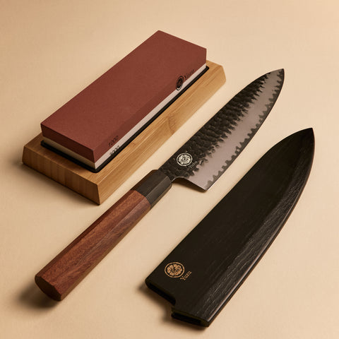Gyuto starter kit contents — whetstone, knife, and wooden saya knife sheath