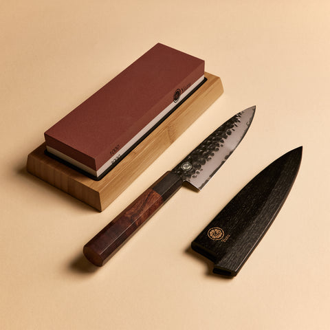 Petty starter kit contents — whetstone, knife, and wooden saya knife sheath