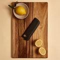 Nakiri saya knife sheath on a cutting board with lemons